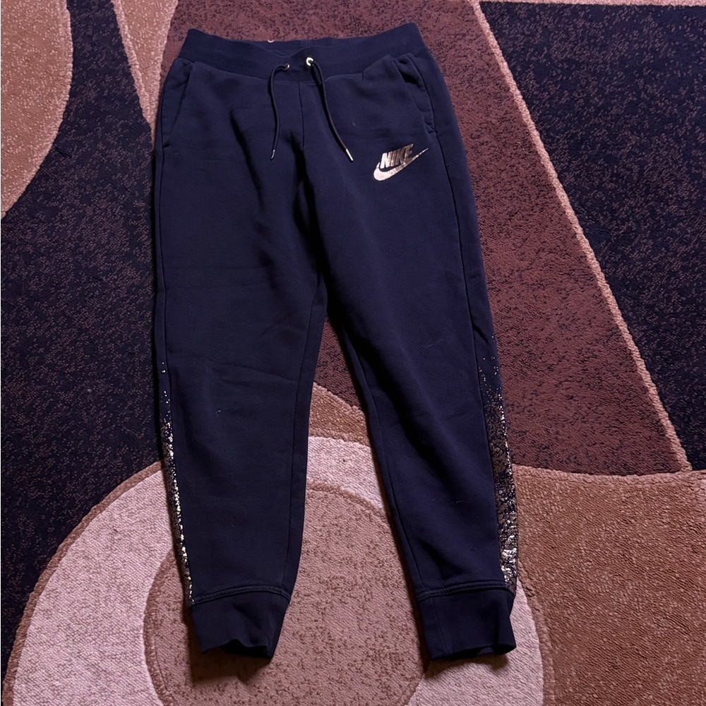 Nike women’s black Joggers with gold Logo